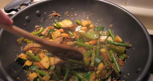 Stir-Fry Vegetables Being Cooked in Wok