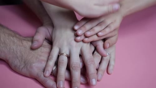 Four Hands Stacked Together in Unity