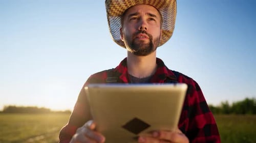 Modern Technology in Farming Portrait of Farmer with Tablet in Field Agronomy Professional