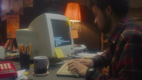 Man Working Late at Old Computer