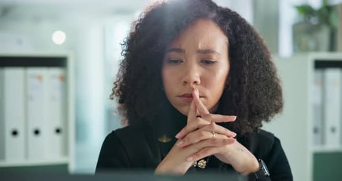 Woman Thinking in Corporate Office Setting