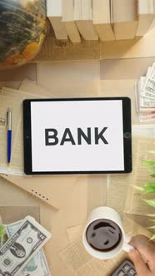 VERTICAL VIDEO OF BANK DISPLAYING ON FINANCE TABLET SCREEN