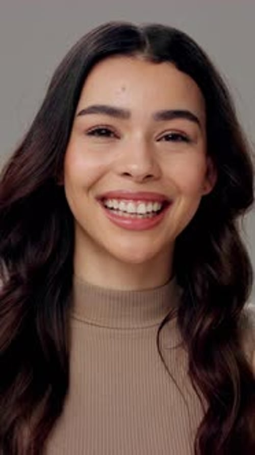 Girl, face and happy in studio for hair care, salon or pleased with hairstyle