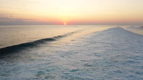 Aerial view of Gili Trawangan Island coastline, Indonesia with sunset sunlight. Big wave on sand be