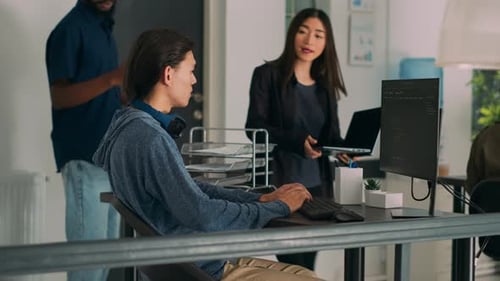Asian Team of IT Engineers Analyzing Html Code on Terminal Window