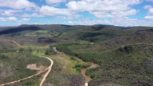 aerial drone shot of roads in the middle of dry hills. Irregular roads on hills. 4K videos.