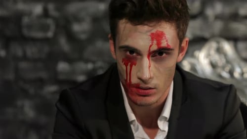 Young Adult with Bloody Halloween Makeup Close Up