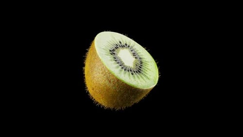 Medio kiwi sobre fondo negro