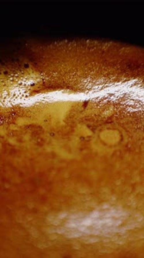 Brewing Espresso with Rich Crema Showcasing Texture in a Cozy Cafe at Dawn