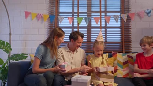 Family Celebrating Girl's Birthday at Home