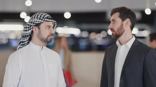 Businessmen Talking in a Modern Office Setting