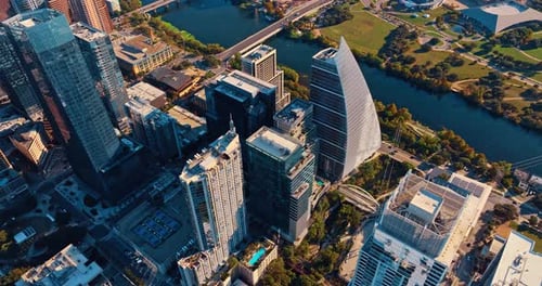 Rising over the tops of high-rises in modern Austin downtown, Texas, USA.