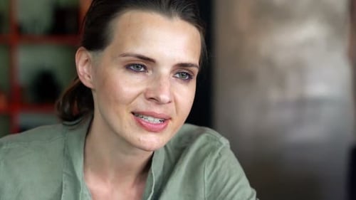 Woman enjoying delicious pasta in a restaurant
