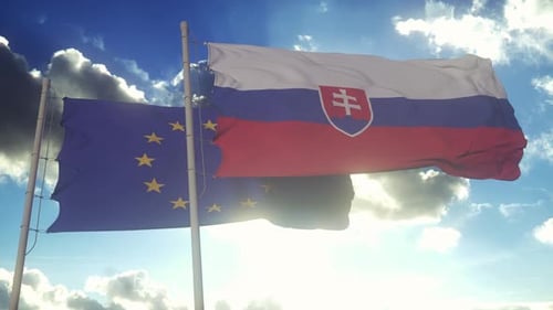 Realistic Flags of Slovakia and European Union Waving in Sunny Sky