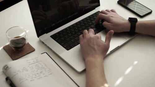 Man working on laptop on the table