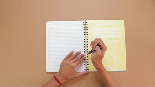 Binding a spiral in the notebook, handmade notebook top down view