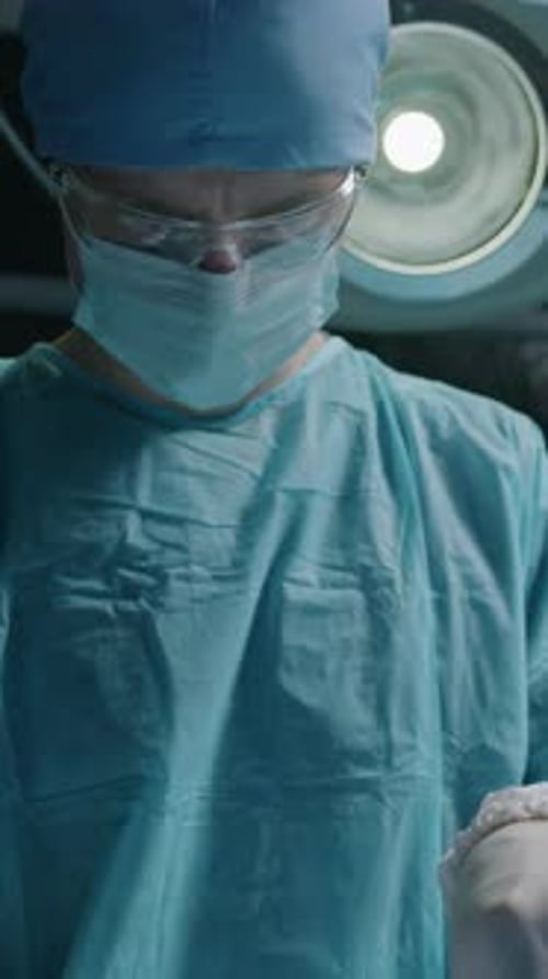 Concentrated Doctor Performing Surgical Operation