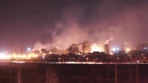 Industrial Timelapse of Mariupol Steel Plant Operations at Night Glowing Furnaces Smokestack
