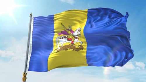 Waving National Flag of Moldova Against Blue Sky