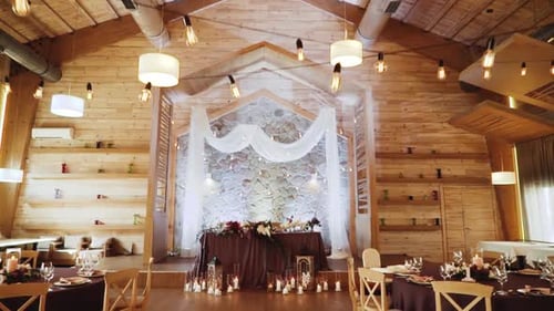 Wooden Banquet Hall with Decorations and Banquet Tables
