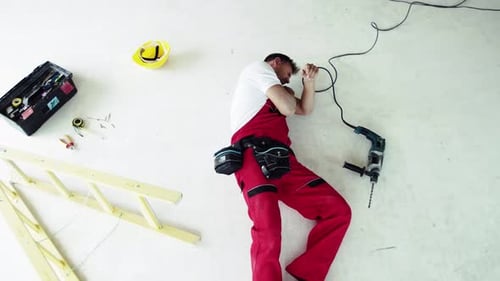 Top View of an Injured Man Lying on the Floor After An
