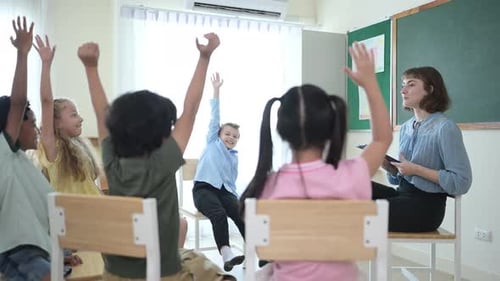 Teacher and students, Learn and study in a classroom of school where youngsters sit and listen