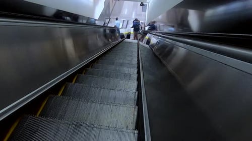 footage of not so busy airport escalator