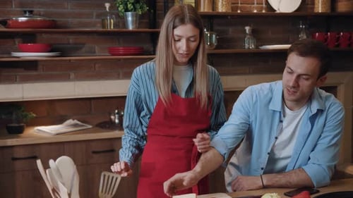 Friends Making Sandwiches Together in a Cozy Kitchen
