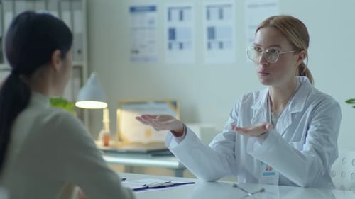 Doctor Consults with Patient in Bright Office