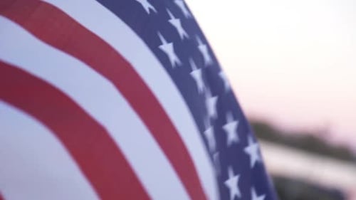 Waving American Flag at Sunset Close Up