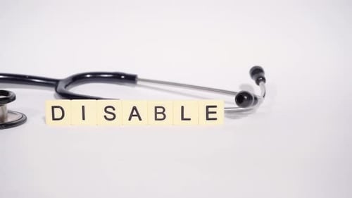 Stethoscope Lays Next to Word Disable Spelt Out