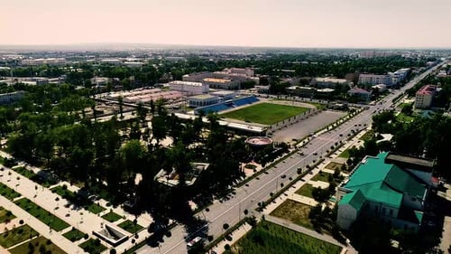 A stadium inside a green space in the city