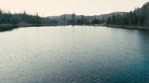 Fly Over The Lagoon With Waterfront Cabins In Saint-Come, Quebec, Canada. Aerial Drone