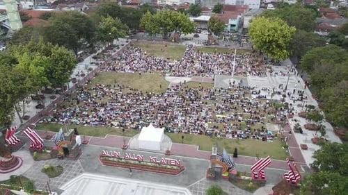 An aerial footage of Muslim congregation praying Eid in the field
