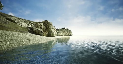 Serene Coastline Beside Peaceful Waters at Sunrise Near Rocky Cliffs