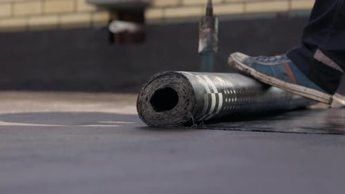 Installing Torch Applied Bitumen Roofing Membrane on Flat Roof