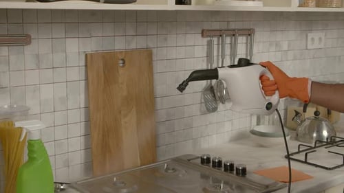 Handheld Steam Cleaner Used in Kitchen Close Up