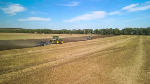 Tractors plowing the field in Ukraine