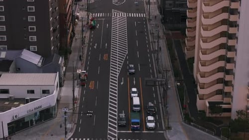 High Angle View of Wide Street Tilt Up Reveal Multistorey Residential Buildings in Urban District