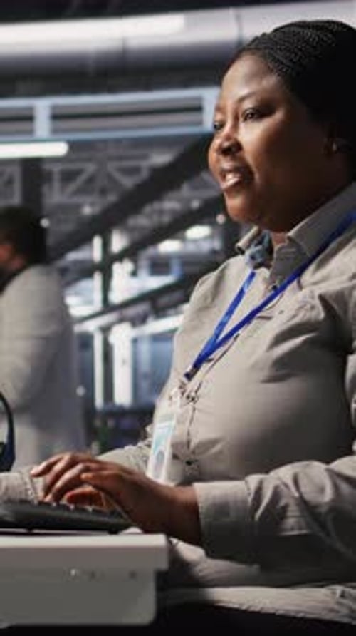 Vertical Video Data Center Computer Scientist Using PC to Monitor Artificial Intelligence