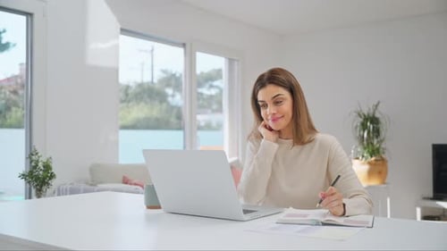 Happy Mature Woman Using Laptop Computer Sitting at Home Table Elearning