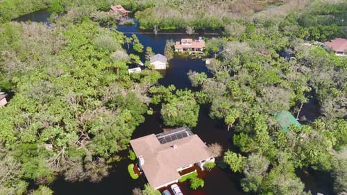 Heavy Flood with High Water Surrounding Residential Houses After Hurricane Ian Rainfall in Florida