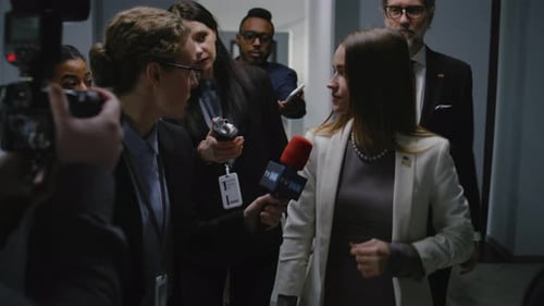 Female US Politician Surrounded By Crowd of Journalists