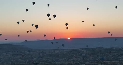 Aerial Cinematic Drone View of Colorful Hot Air Balloon Flying Over Cappadocia