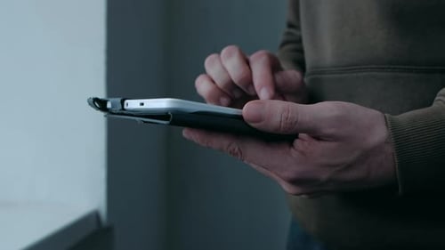 Close Up of Person Using Tablet Device