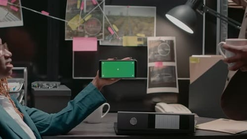Team of Law Inspectors Analyzing Greenscreen Display