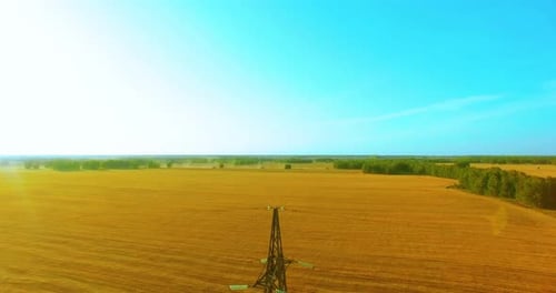 Vertical Movement Flight Near High Voltage Electricity Tower and Power Lines at Green and Yellow