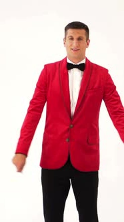 funny man in red suit is making funny movement with his hands