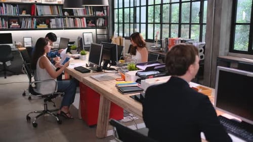 Pretty business woman walk to discuss the work project with manager during working in office