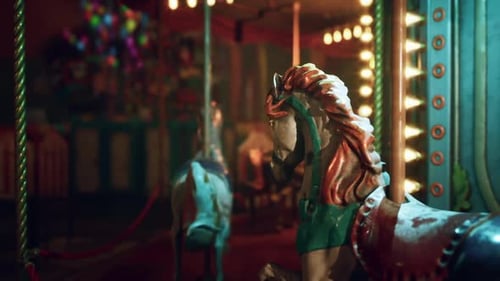 Empty Amusement Park at Night Featuring Deserted Carousel with Vintage Horses